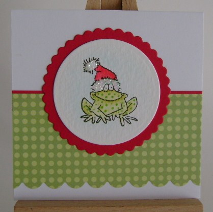 frog green spotted from wearing red santa hat