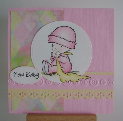 lotv59 baby in pink holding yellow blanket