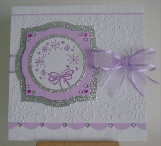 purplesnowflakes white christmas card with purple snowflake wreath and silver glitter mats