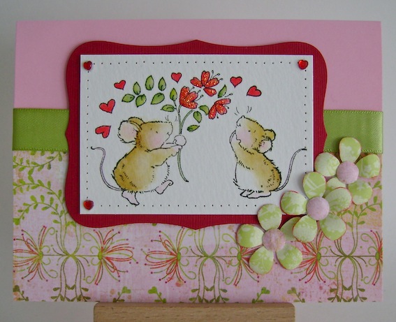 one mice giving another a bouquet of heart flowers