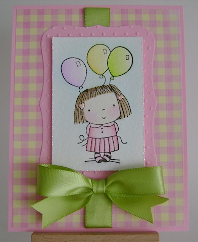 birthday girl with three balloons and bow