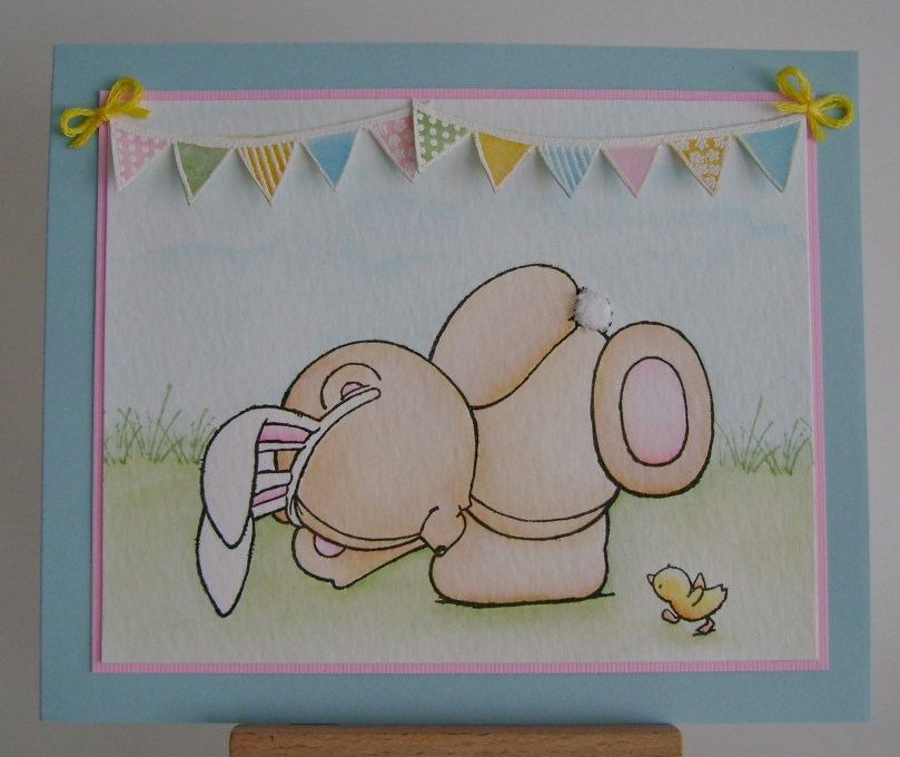 bunteddy teddy with bunny ears and chick walking under teddy in search of eggs