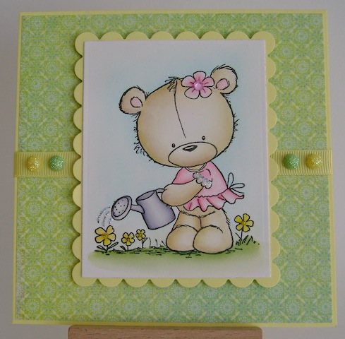 teddy watering yellow flowers in a pink dress