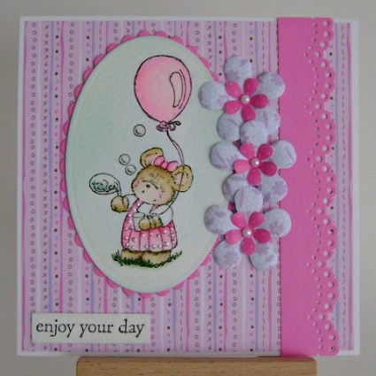 little mouse blowing bubbles in a pink dress and pink balloon