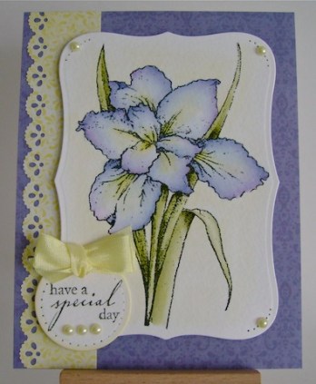 purple and blue iris flower with pearls and yellow ribbon trim