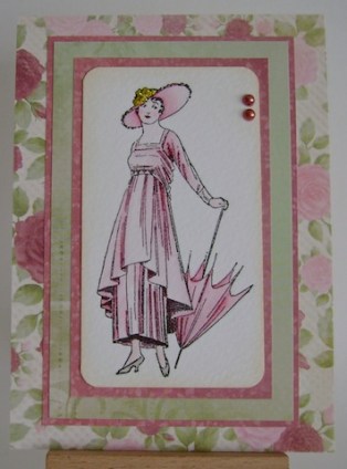 vintagelady vintage lady with hat and parasol in pink surrounded by pink and green floral paper