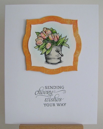 glittered yellow and orange tulips in bucket on clean and simple card