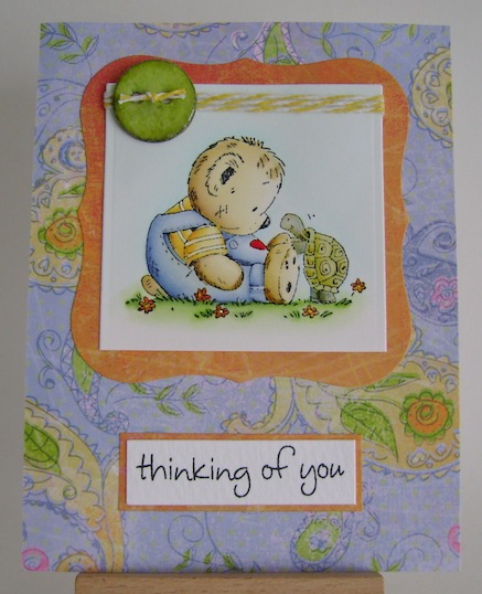 teddy sitting on the ground with turtle in blue green and orange card