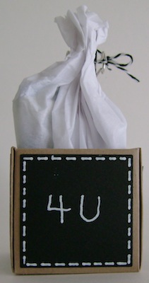 little box with the words four you in white text on black paper