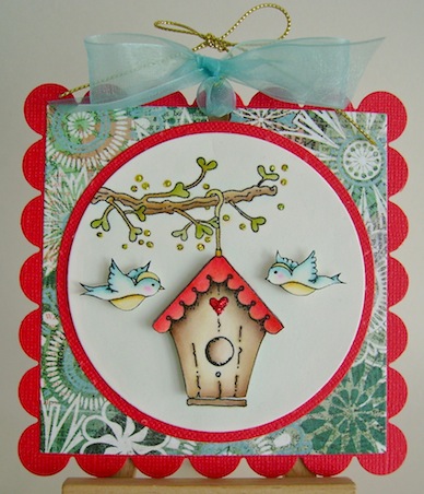 square scalloped card featuring birdhouse hanging from a branch with two blue birds