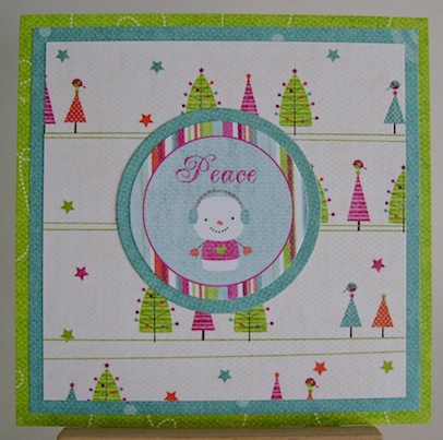 rudolphdayoctober2011 christmas card with snowman and peace sentiment in bright blue, green, pink and orange
