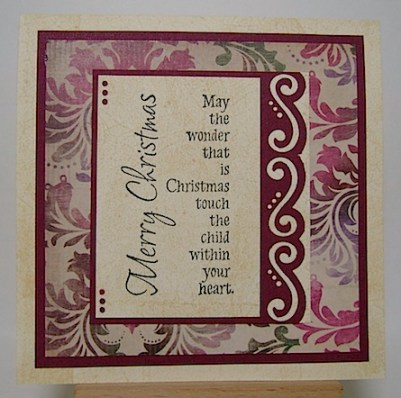 christmas card in maroon, green and ivory with sentiment as focus on front 