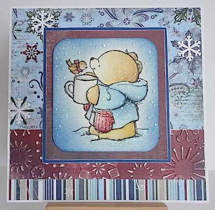 forever friends teddy with a bird perched on its mug in the snow