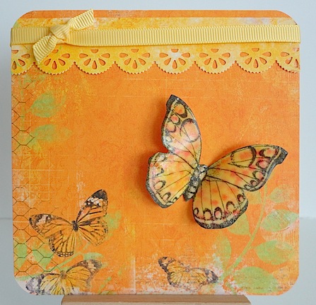 card in orange with yellow ribbon and butterflies