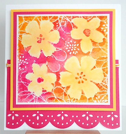 card with four yellow flowers on pink, tangerine and white base