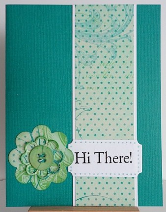 teal card with hi there sentiment and layered diec cut flower
