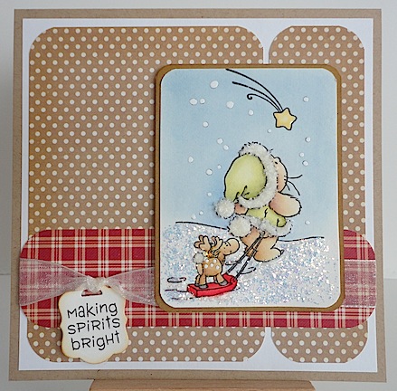 card with bunny pulling sled holding reindeer on brown with white polka dot paper and red check paper trim; also a making spirits bright sentiment
