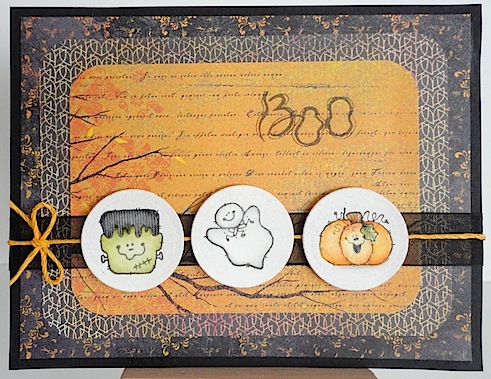 halloween card with three penny black stamps and a boo sentiment on orange and black papers