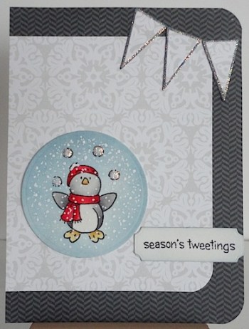 christmas card with penguin juggling snowballs, wearing a red hat and scarf and a season's tweetings sentiment