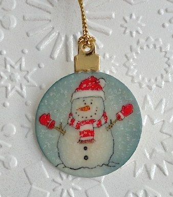 miniature tree ornament with snowman