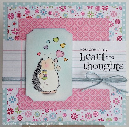 valentine card with penny black hedgie blowing heart bubbles with pinks and blues papers