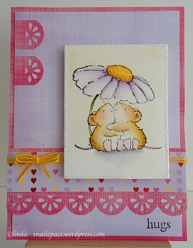 valentine card in pink, purple and yellow with two mice hugging under a daisy