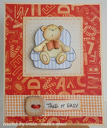 teddy sleeping in a chair with an open book and a take it easy sentiment