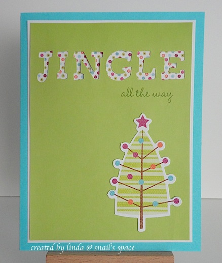 christmas card in green with dotted tree and jingle all the way sentiment on a blue base