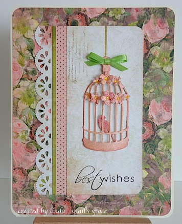 card in bronze and green with diecut birdcage, bird and flowers with best wishes sentiment
