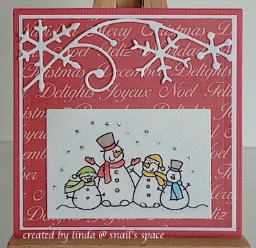 three inch square christmas card in red and white with four snowmen and a die cut snowflake border across the top