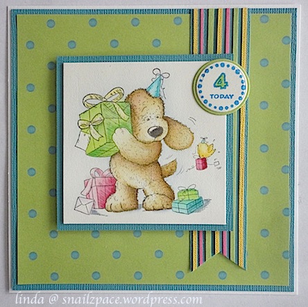 birthday card in bright colours featuring a dog with presents