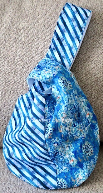 blue fabric knot bag