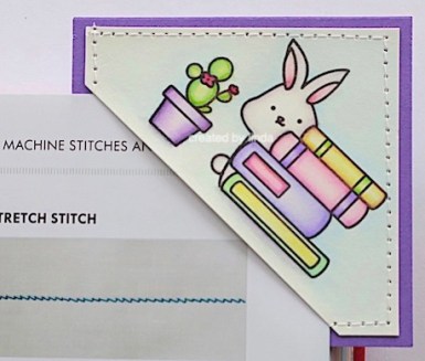 corner bookmark featuring bunny and books